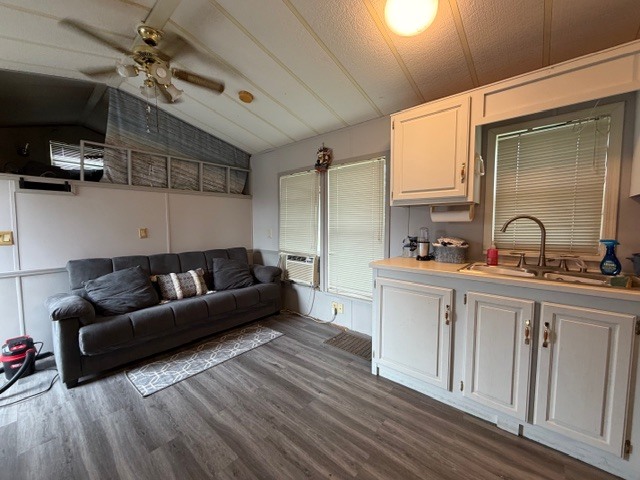 2795 East 28th Road Marseilles, IL 61341 - Photo 4 of 54 a living room with furniture a flat screen tv and a sink