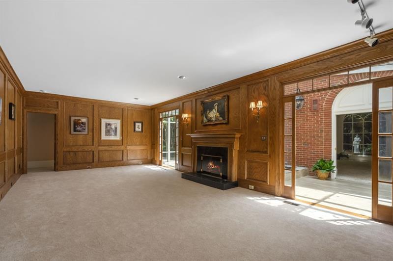 1120 Heards Ferry Road Northwest Sandy Springs, GA 30328 - Photo 12 of 50 a view of empty room with a fireplace