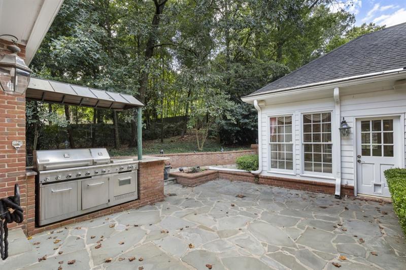 1120 Heards Ferry Road Northwest Sandy Springs, GA 30328 - Photo 42 of 50 a view of a house with backyard and sitting area