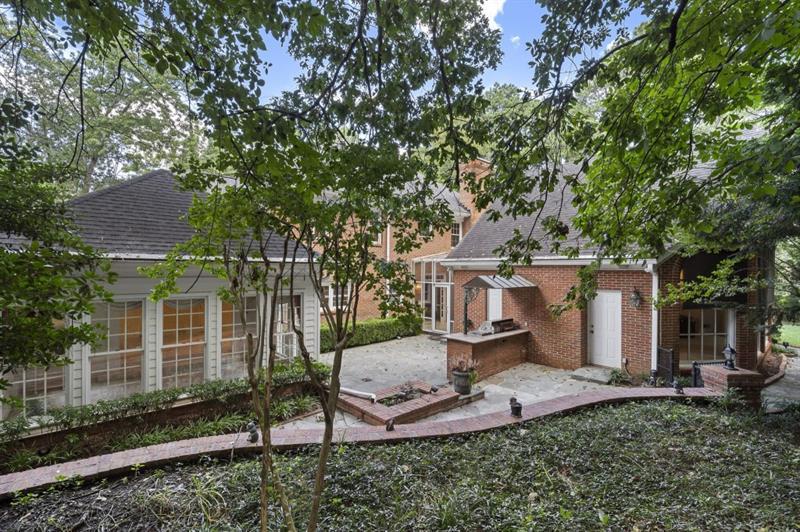 1120 Heards Ferry Road Northwest Sandy Springs, GA 30328 - Photo 43 of 50 front view of a house with a tree