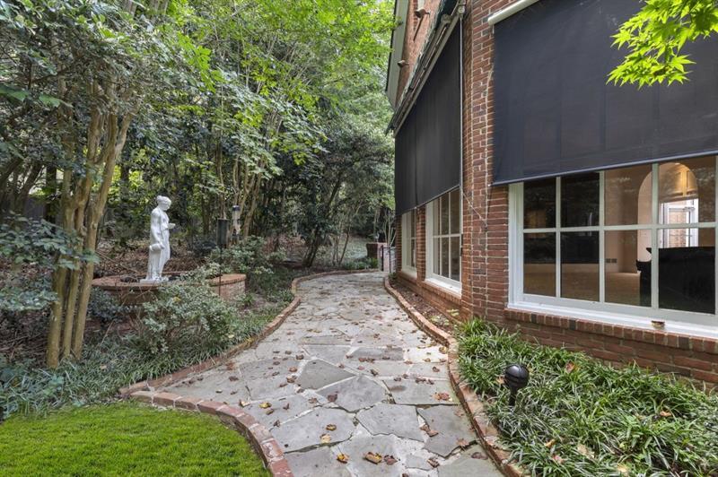 1120 Heards Ferry Road Northwest Sandy Springs, GA 30328 - Photo 45 of 50 front view of a house with a garden