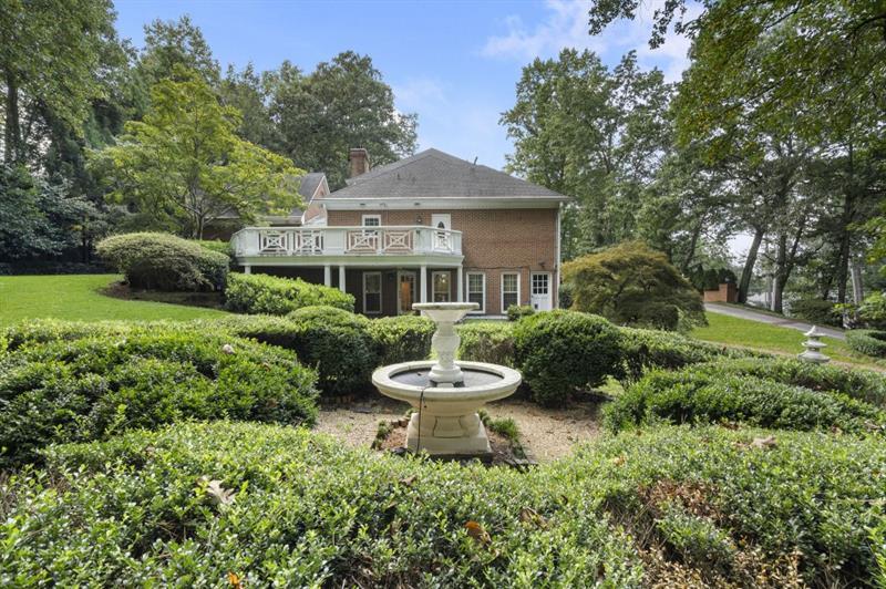 1120 Heards Ferry Road Northwest Sandy Springs, GA 30328 - Photo 47 of 50 a front view of a house with a garden