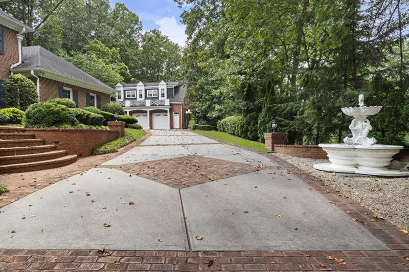 1120 Heards Ferry Road Northwest Sandy Springs, GA 30328 - Photo 48 of 50 a front view of a house with a yard