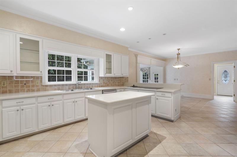 1120 Heards Ferry Road Northwest Sandy Springs, GA 30328 - Photo 8 of 50 a kitchen with a sink and cabinets