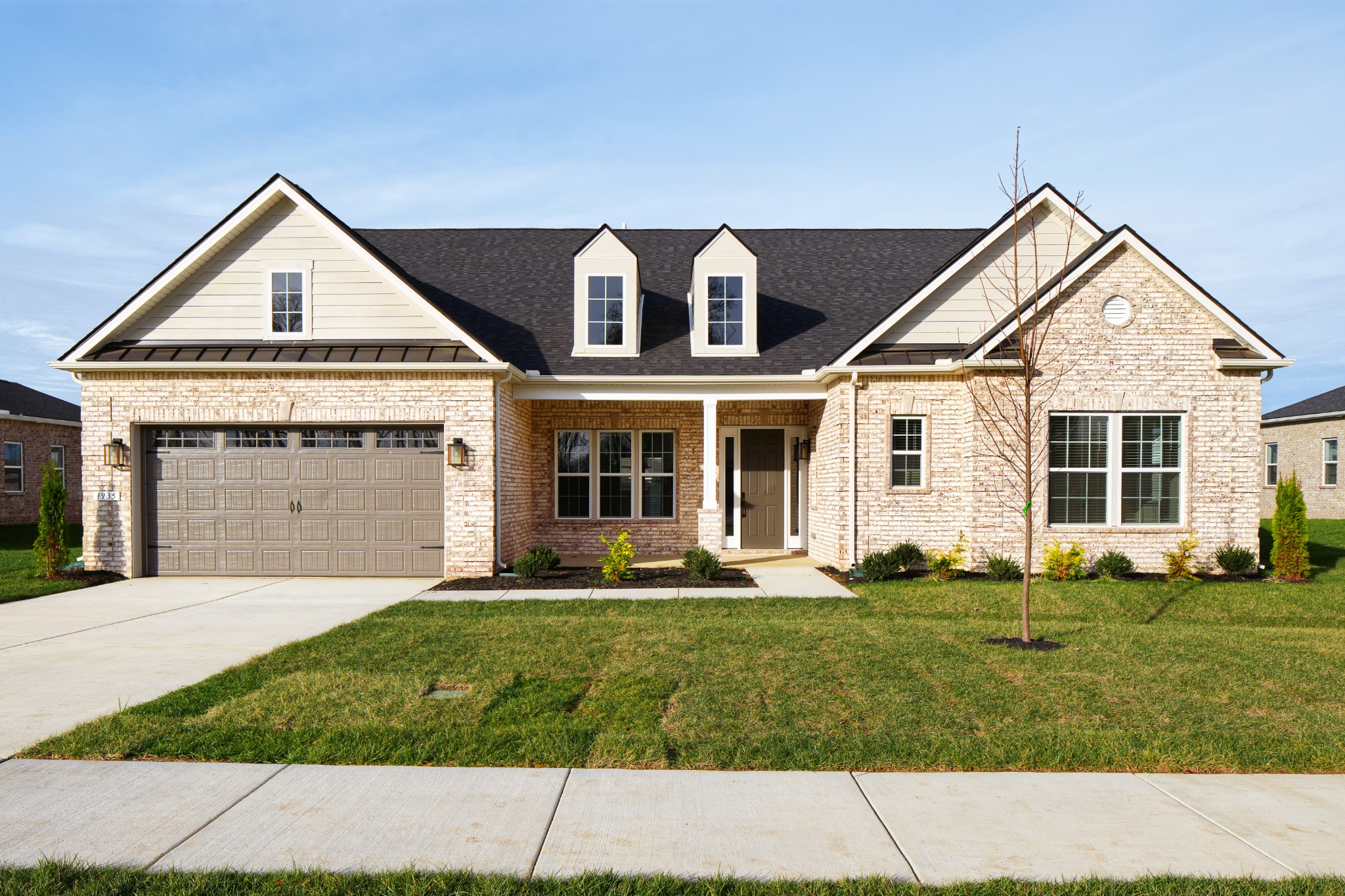 front view of a house with a yard