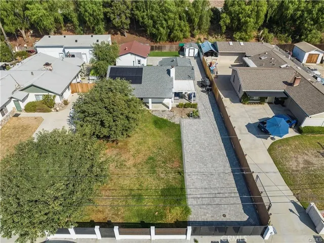 an aerial view of a house with garden space and sitting space