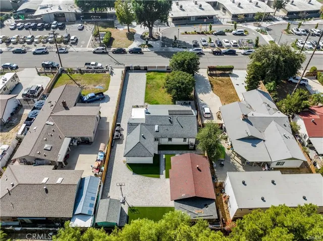 an aerial view of residential house with swimming pool