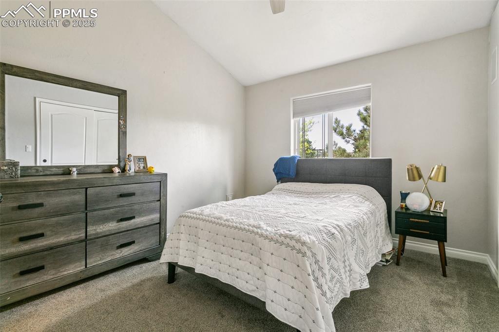 1502 York Road, Unit 103 Colorado Springs, CO 80920 - Photo 13 of 27 a bedroom with a bed and painting on the wall