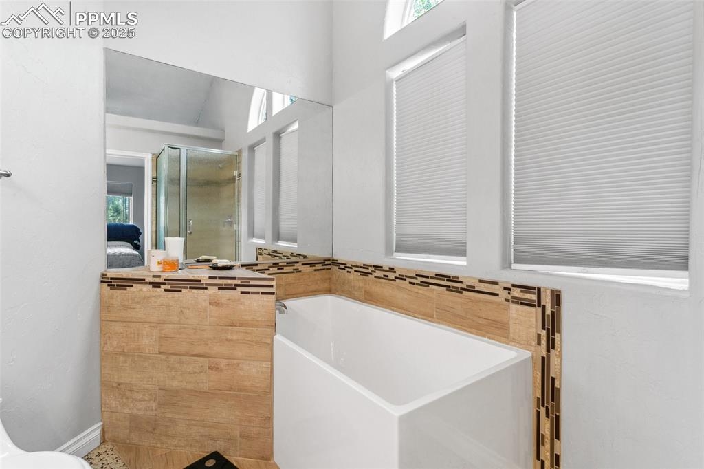 1502 York Road, Unit 103 Colorado Springs, CO 80920 - Photo 16 of 27 a bathroom with a sink and a mirror
