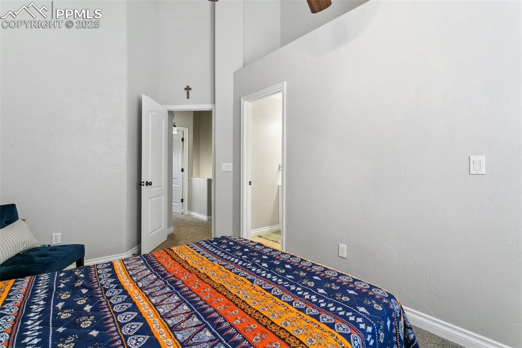 1502 York Road, Unit 103 Colorado Springs, CO 80920 - Photo 18 of 27 a bedroom with bed and rug