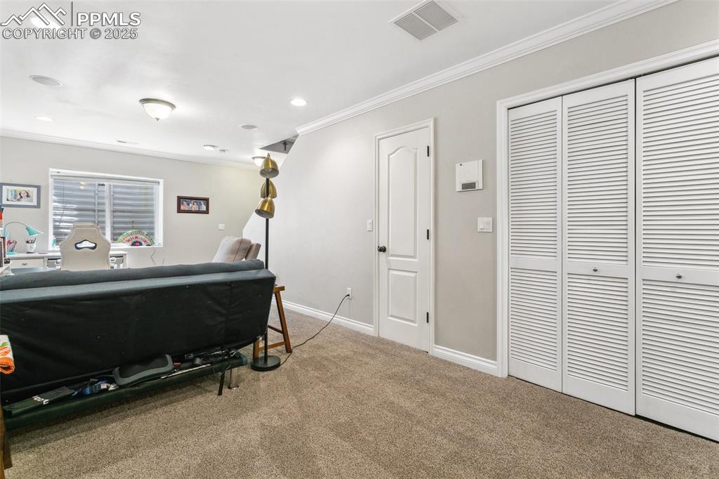 1502 York Road, Unit 103 Colorado Springs, CO 80920 - Photo 22 of 27 a bedroom with furniture