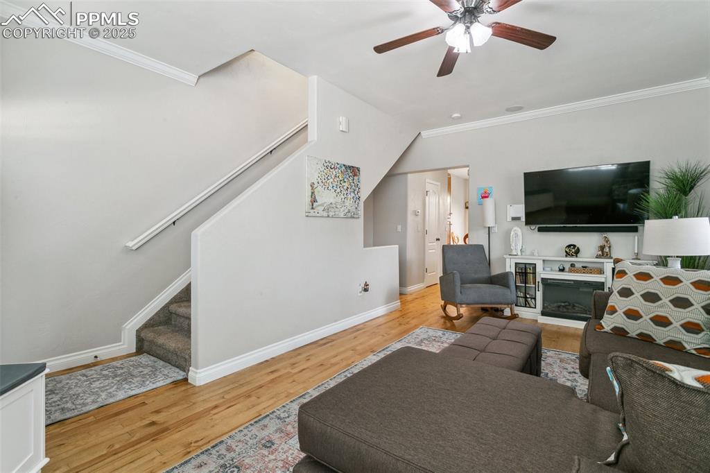 1502 York Road, Unit 103 Colorado Springs, CO 80920 - Photo 6 of 27 a living room with furniture and a flat screen tv