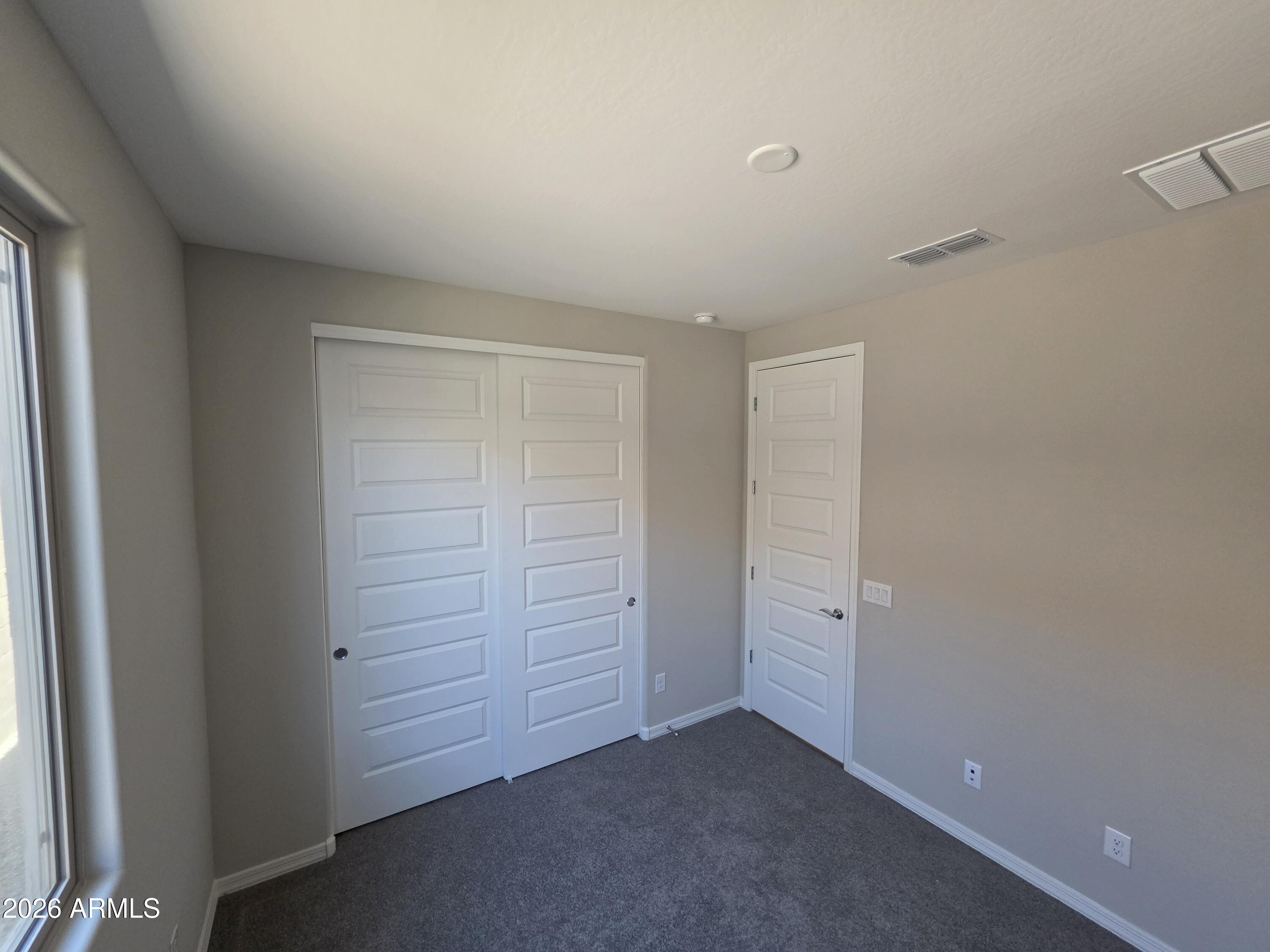 7128 West Coles Road Laveen, AZ 85339 - Photo 28 of 38 an empty room with closet