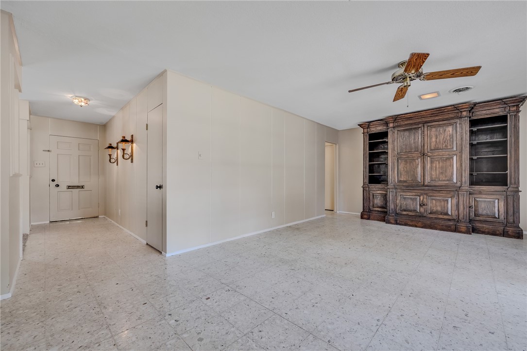 3401 Floyd Street Corpus Christi, TX 78411 - Photo 12 of 39 an empty room with fireplace and window