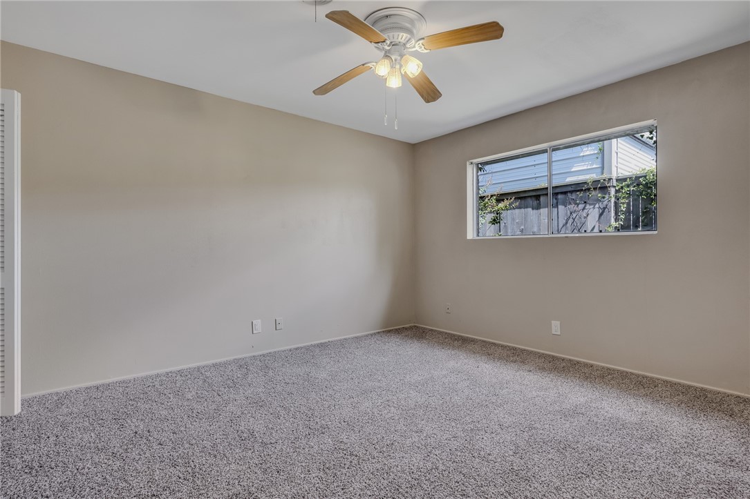 3401 Floyd Street Corpus Christi, TX 78411 - Photo 26 of 39 an empty room with a window and a fan