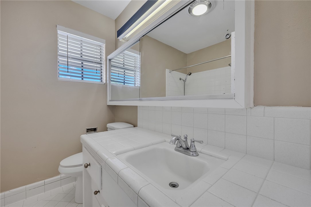 3401 Floyd Street Corpus Christi, TX 78411 - Photo 31 of 39 a bathroom with a sink and a toilet