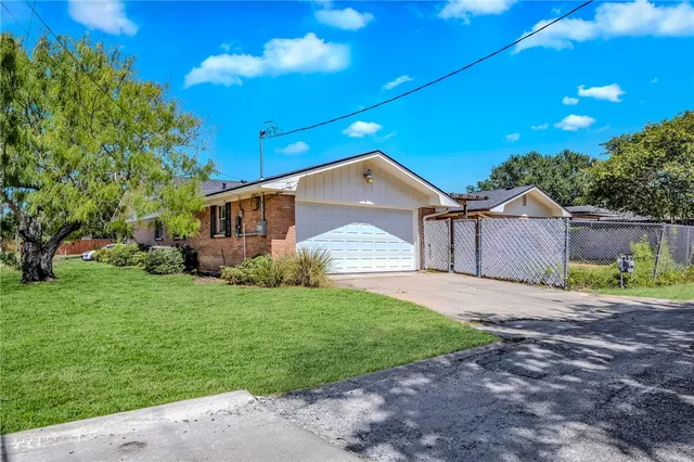 a view of a backyard of the house