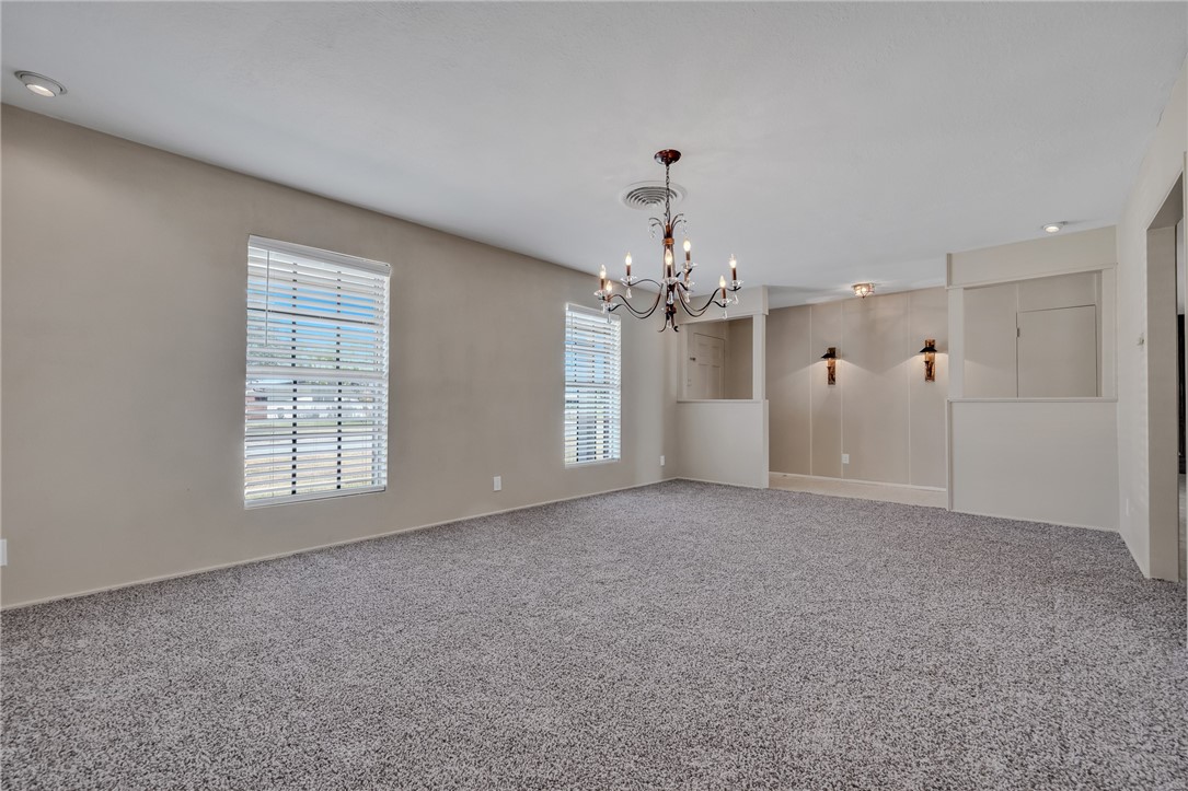 3401 Floyd Street Corpus Christi, TX 78411 - Photo 6 of 39 a view of a big room with windows and chandelier