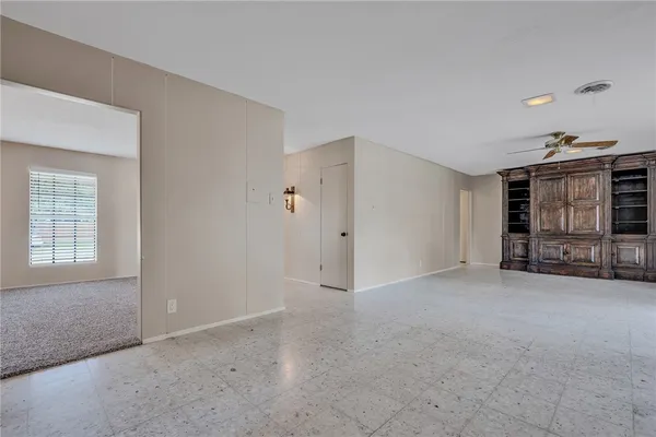 a view of an empty room with a window