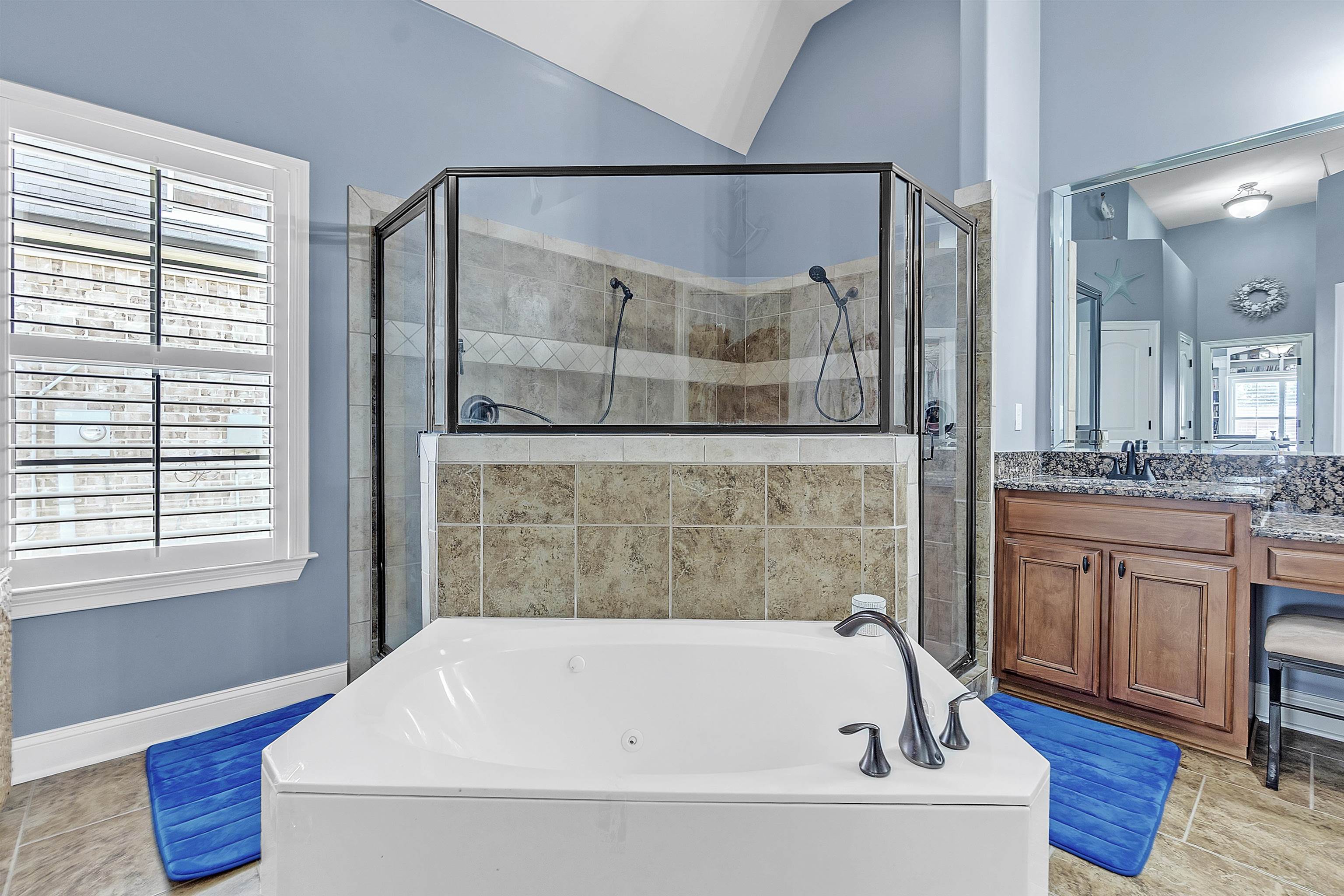 200 Misty Fields Road Oakland, TN 38060 - Photo 21 of 40 Full bathroom featuring light tile patterned floors, a shower stall, and vanity