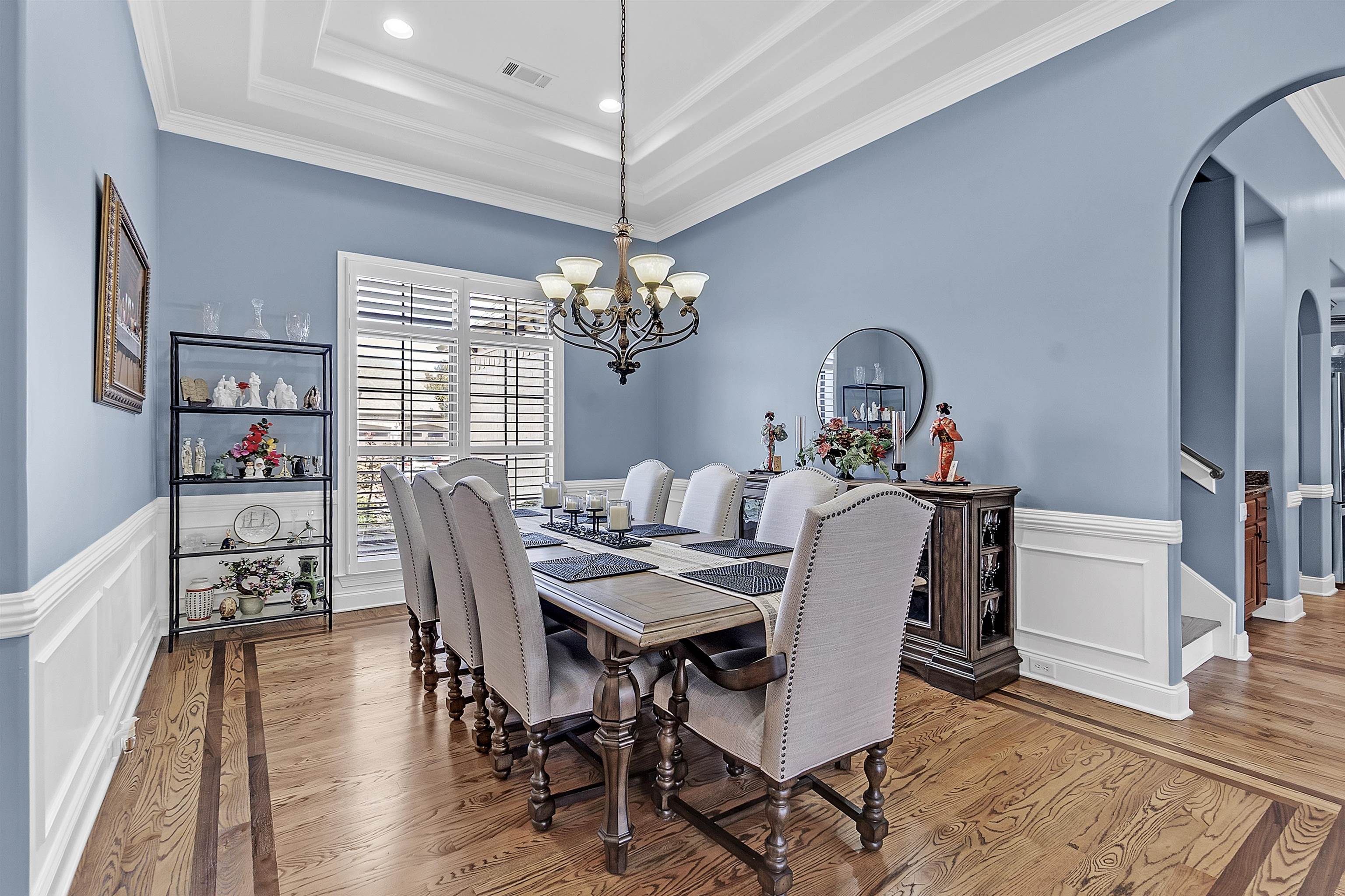 200 Misty Fields Road Oakland, TN 38060 - Photo 6 of 40 Dining space with arched walkways, a wainscoted wall, a decorative wall, a raised ceiling, and crown molding