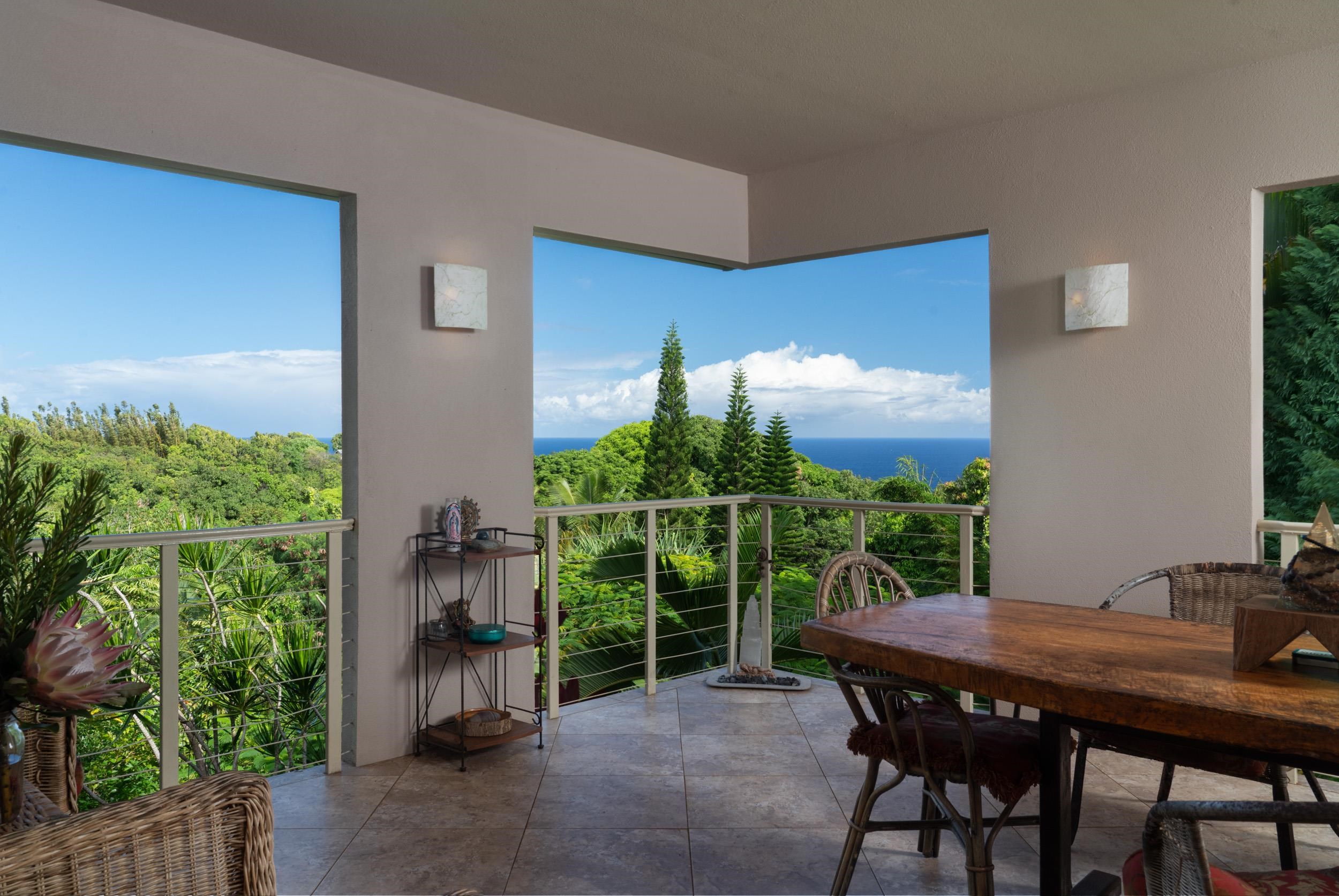 715 North Honokala Road Haiku, HI 96708 - Photo 13 of 50 a view of a porch with furniture and yard
