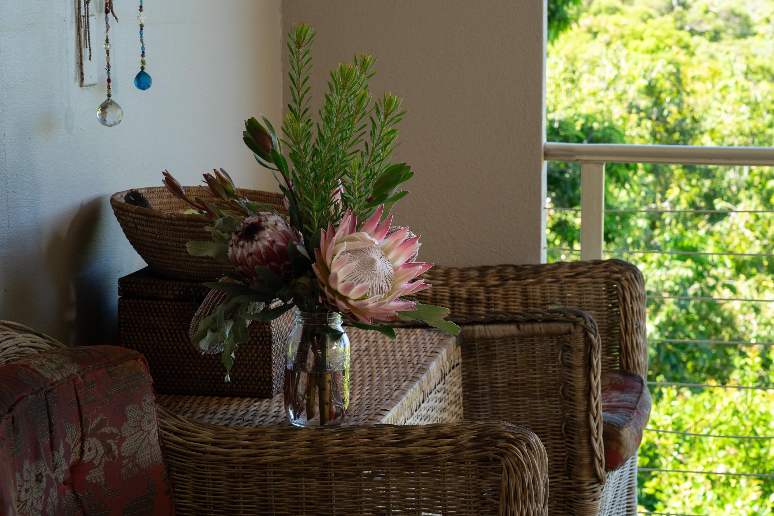 715 North Honokala Road Haiku, HI 96708 - Photo 14 of 50 a vase of flowers sitting on a table