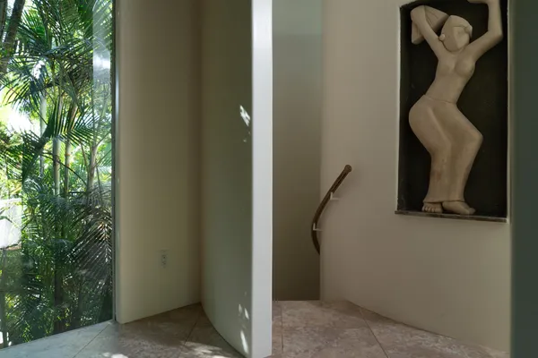 a view of room with a sink and a mirror
