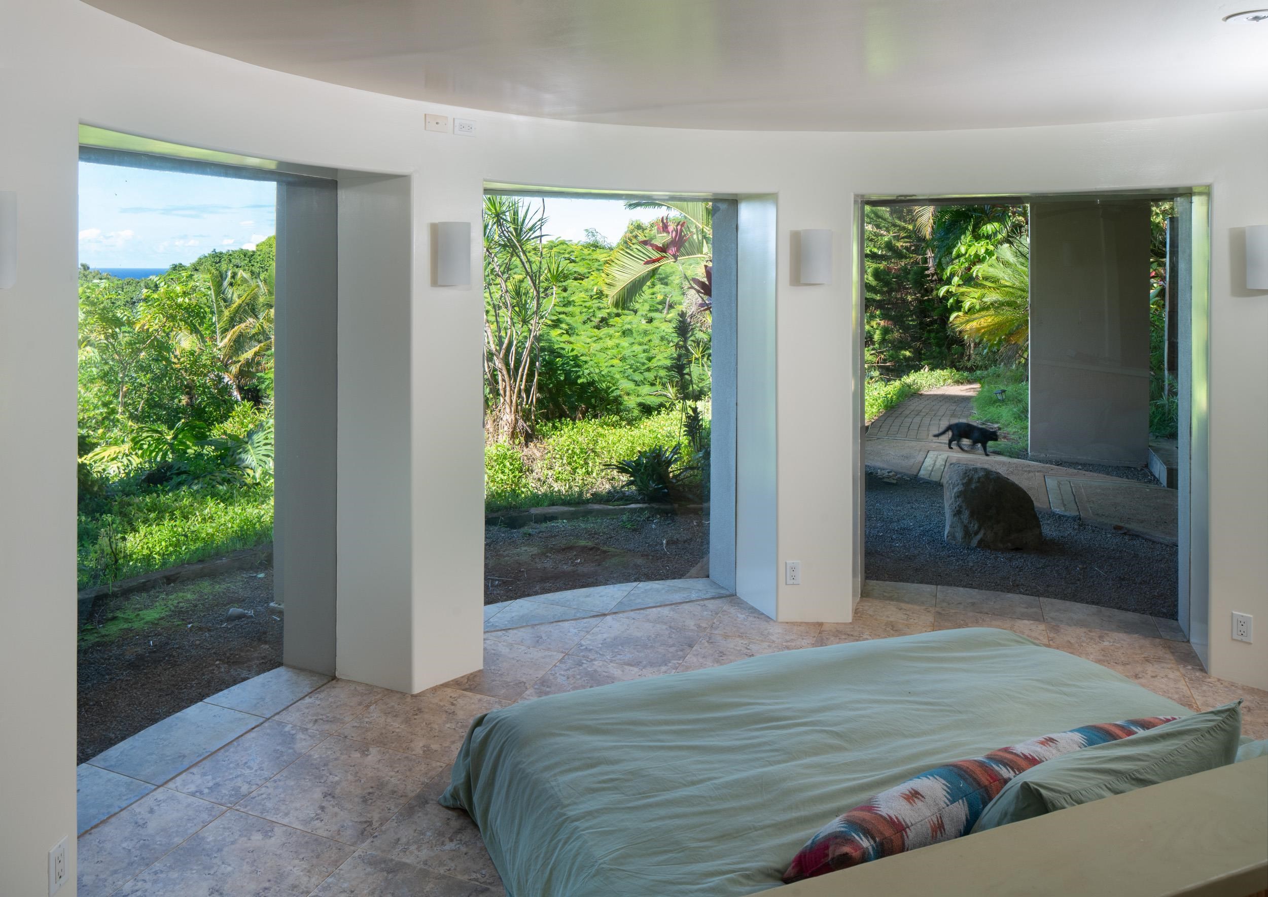 715 North Honokala Road Haiku, HI 96708 - Photo 24 of 50 a view of bedroom with furniture and garden