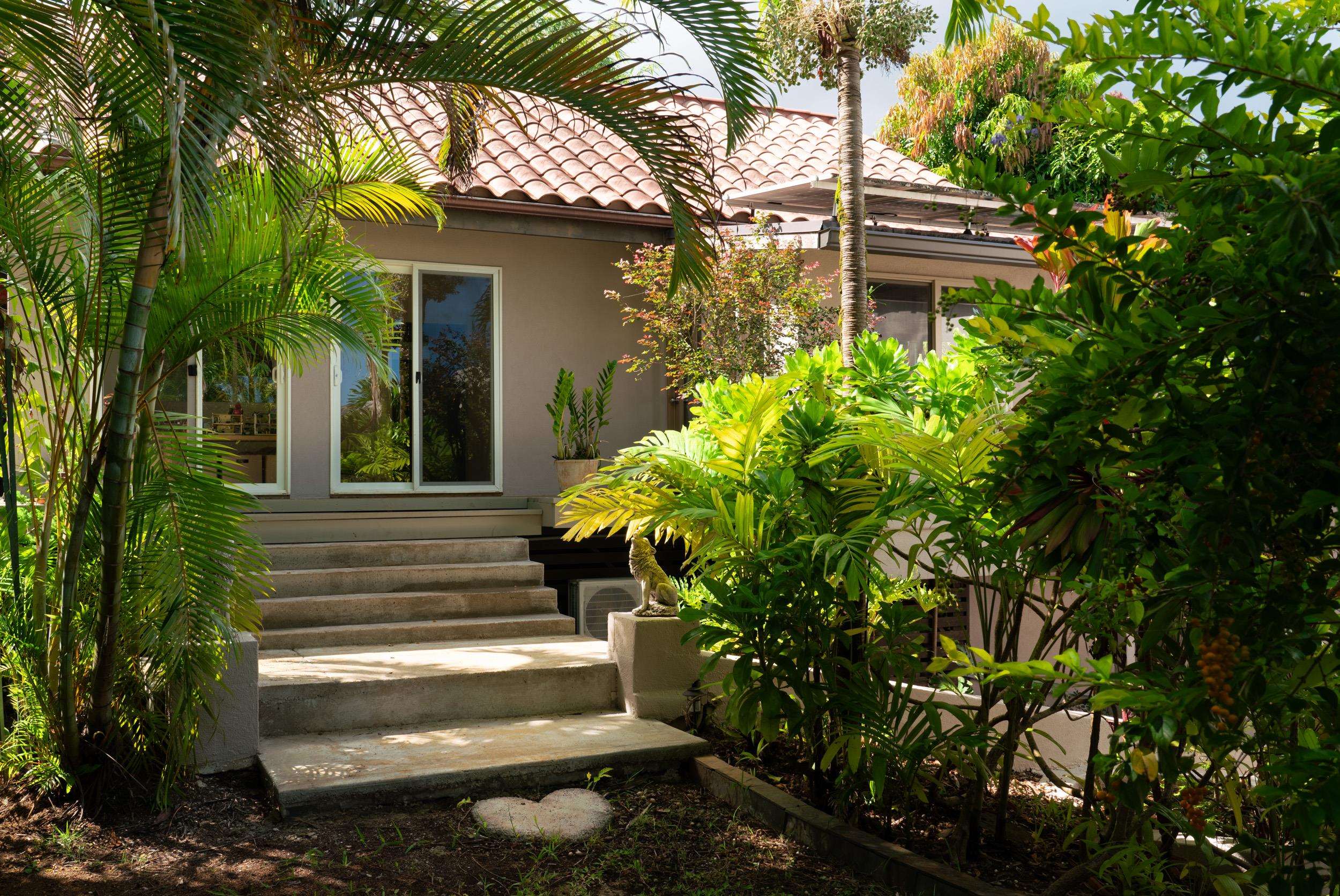 715 North Honokala Road Haiku, HI 96708 - Photo 39 of 50 a view of a house with a flower garden