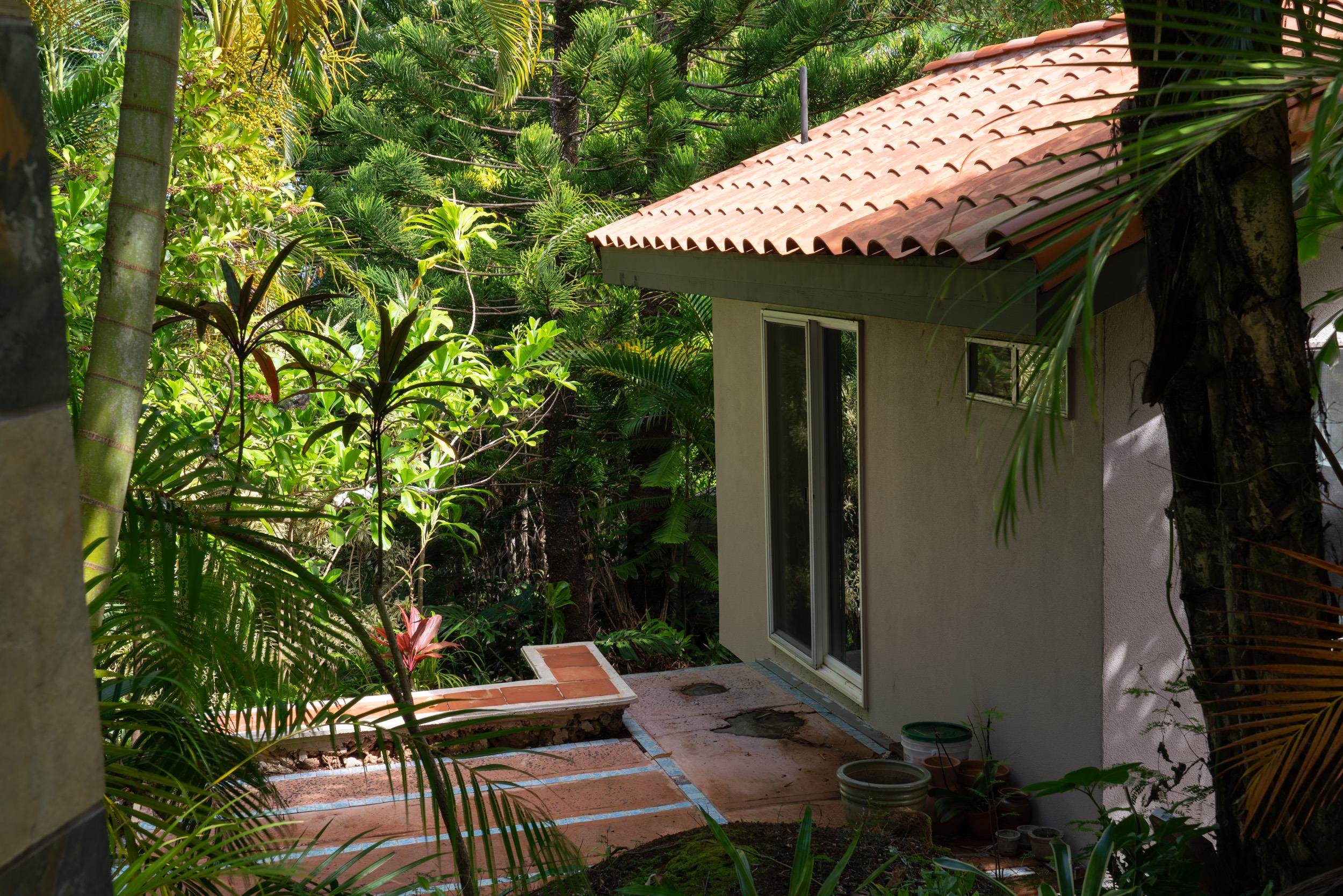 715 North Honokala Road Haiku, HI 96708 - Photo 49 of 50 a view of a chairs and table in backyard of the house