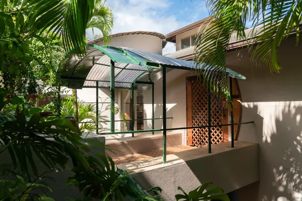 a view of balcony with a small yard