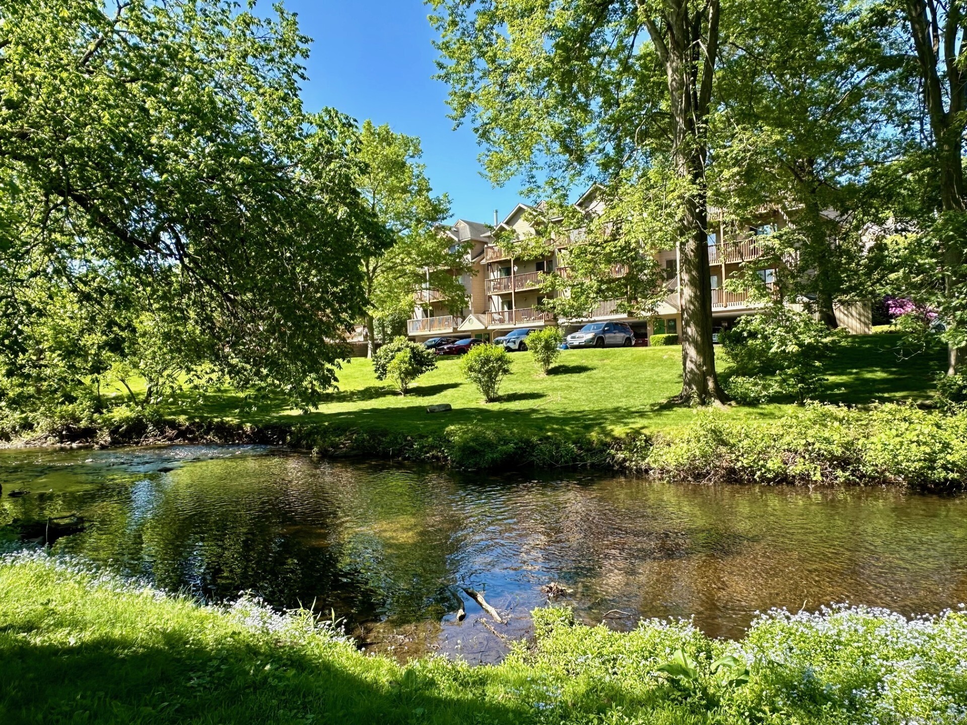 a view of a lake with a house in the background