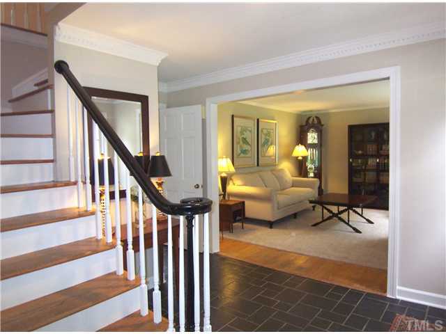 4920 Brookhurst Place Raleigh, NC 27609 - Photo 2 of 24 a bedroom with furniture and a window