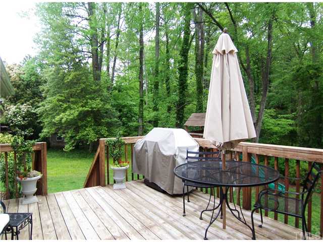 4920 Brookhurst Place Raleigh, NC 27609 - Photo 20 of 24 a view of deck with furniture and garden