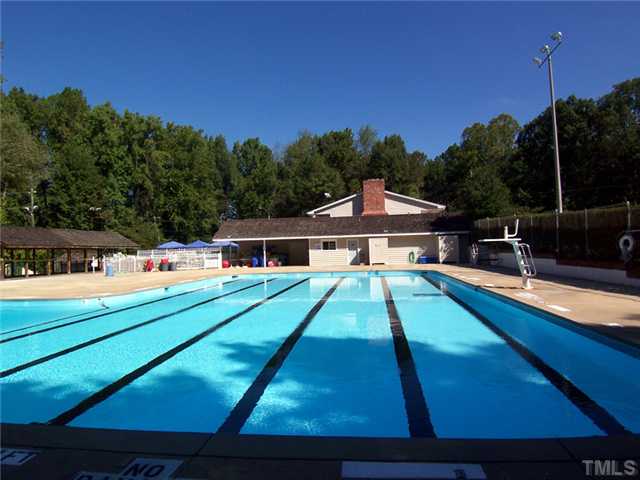 4920 Brookhurst Place Raleigh, NC 27609 - Photo 22 of 24 a aerial view of a house with swimming pool