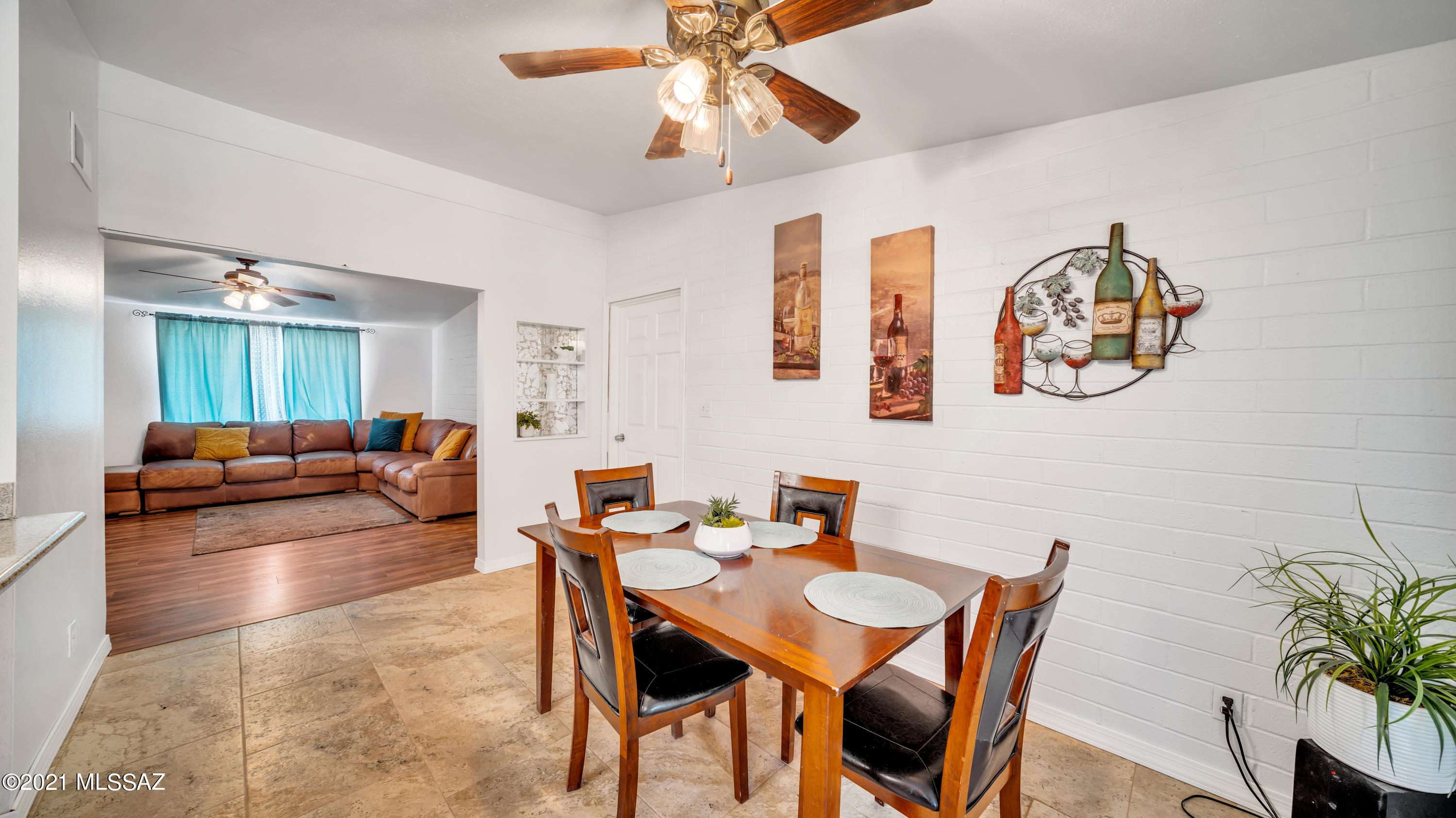 1850 West Saxony Road Tucson, AZ 85713 - Photo 8 of 33 a view of a dining room with furniture and wooden floor