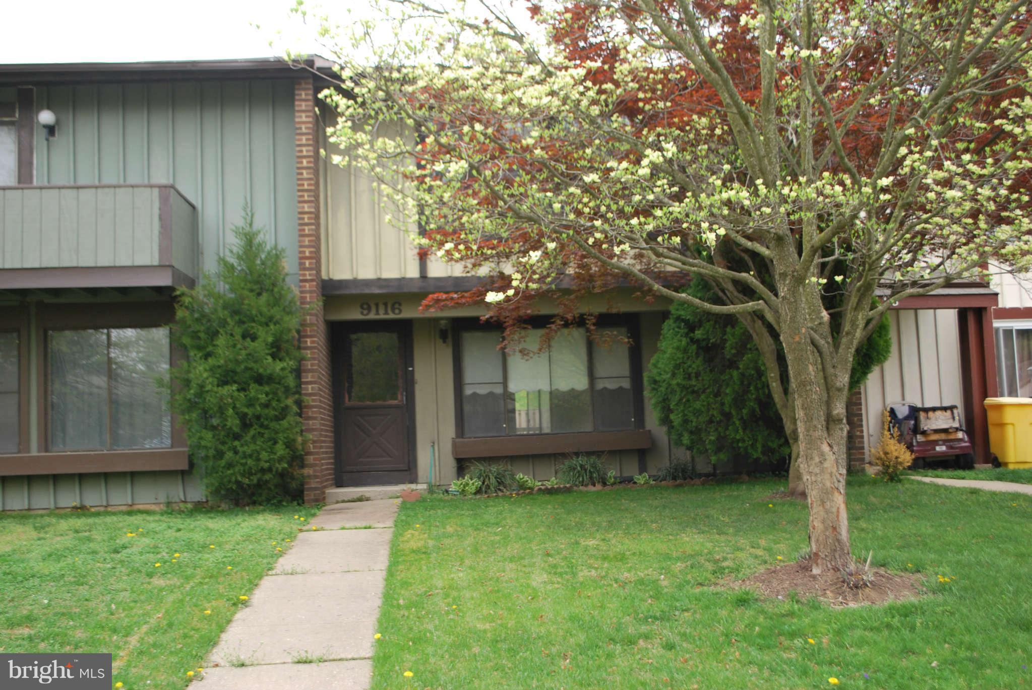 9116 Centerway Road Gaithersburg, MD 20879 - Photo 1 of 25 a view of a backyard with large trees