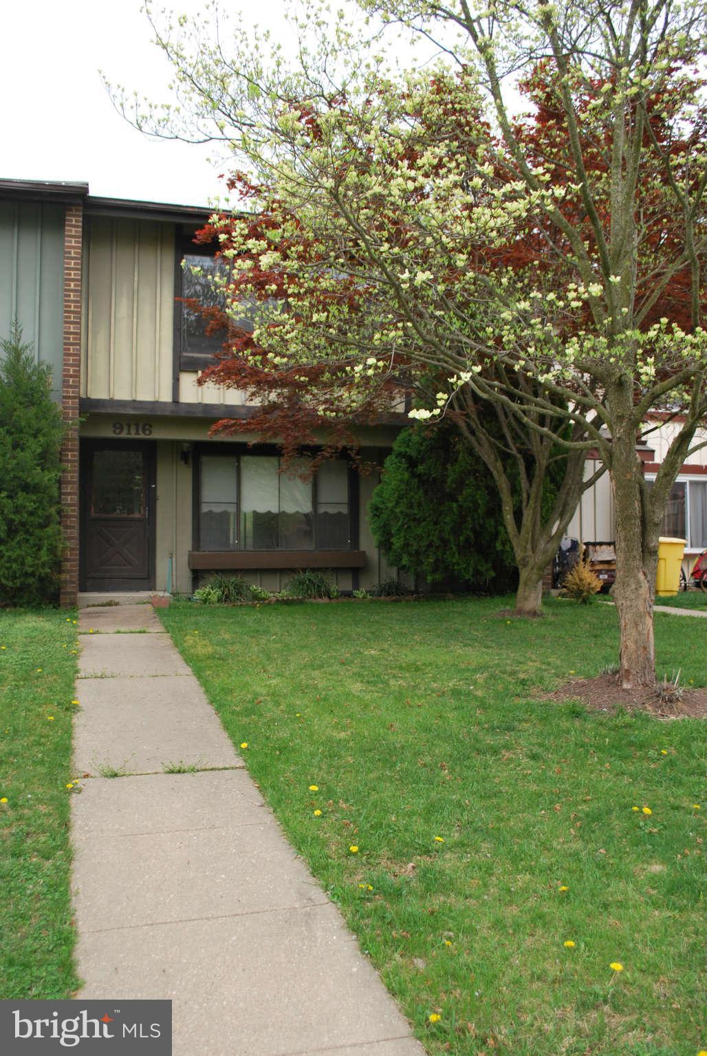 9116 Centerway Road Gaithersburg, MD 20879 - Photo 2 of 25 a front view of a house with a garden