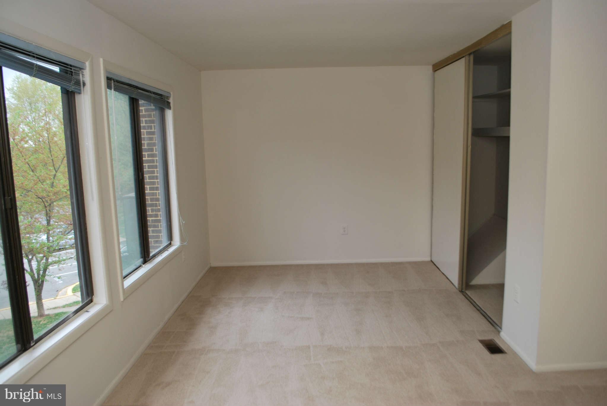 9116 Centerway Road Gaithersburg, MD 20879 - Photo 12 of 25 an empty room with windows