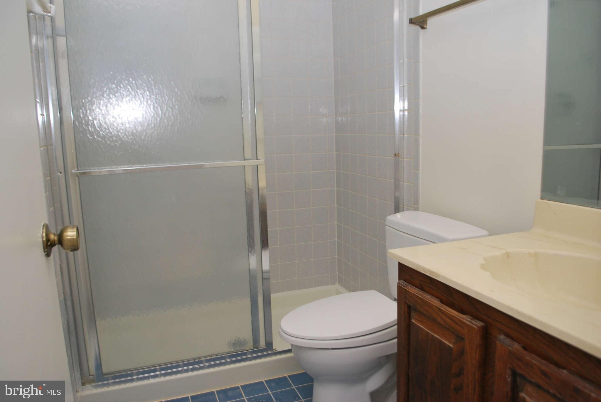 9116 Centerway Road Gaithersburg, MD 20879 - Photo 14 of 25 a bathroom with a sink and toilet