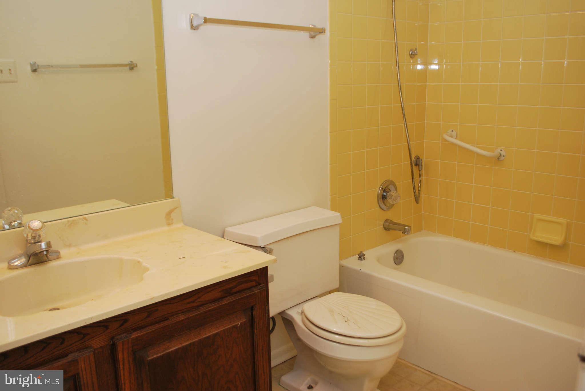 9116 Centerway Road Gaithersburg, MD 20879 - Photo 17 of 25 a bathroom with a sink a toilet and shower