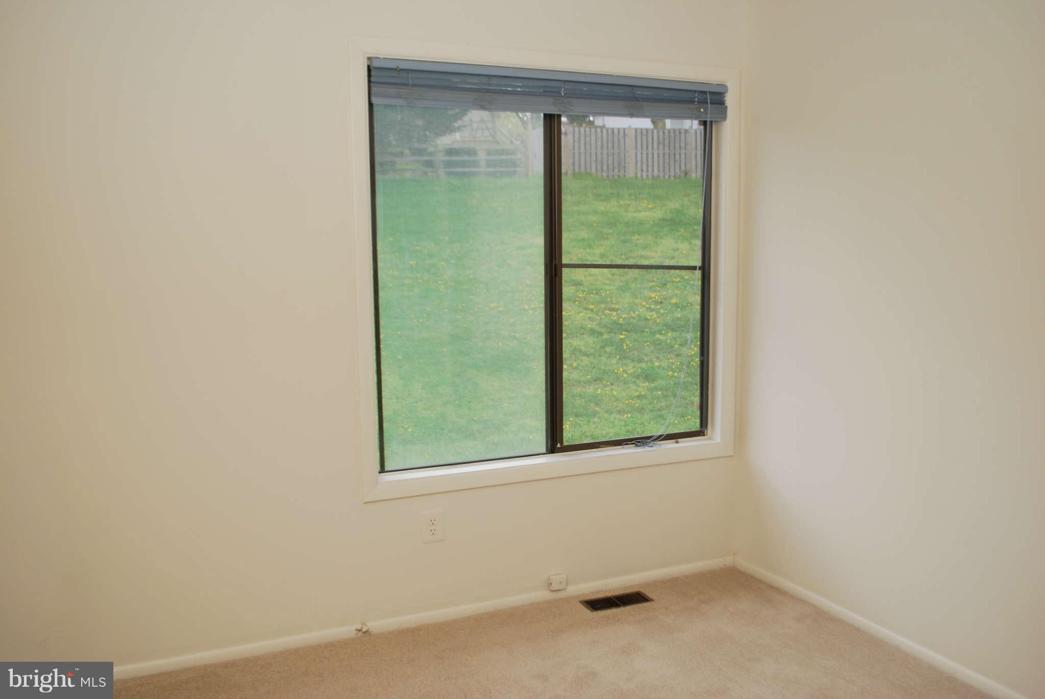 9116 Centerway Road Gaithersburg, MD 20879 - Photo 18 of 25 an empty room with a window