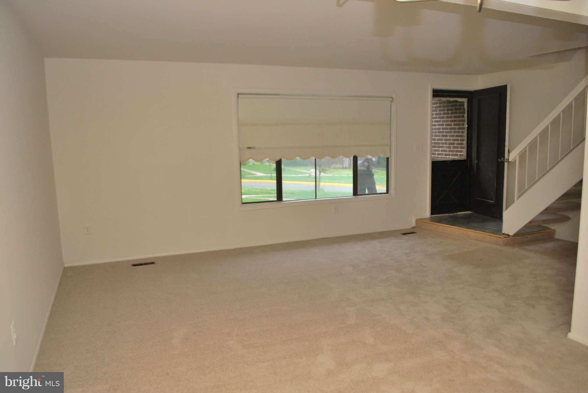 9116 Centerway Road Gaithersburg, MD 20879 - Photo 3 of 25 an empty room with windows