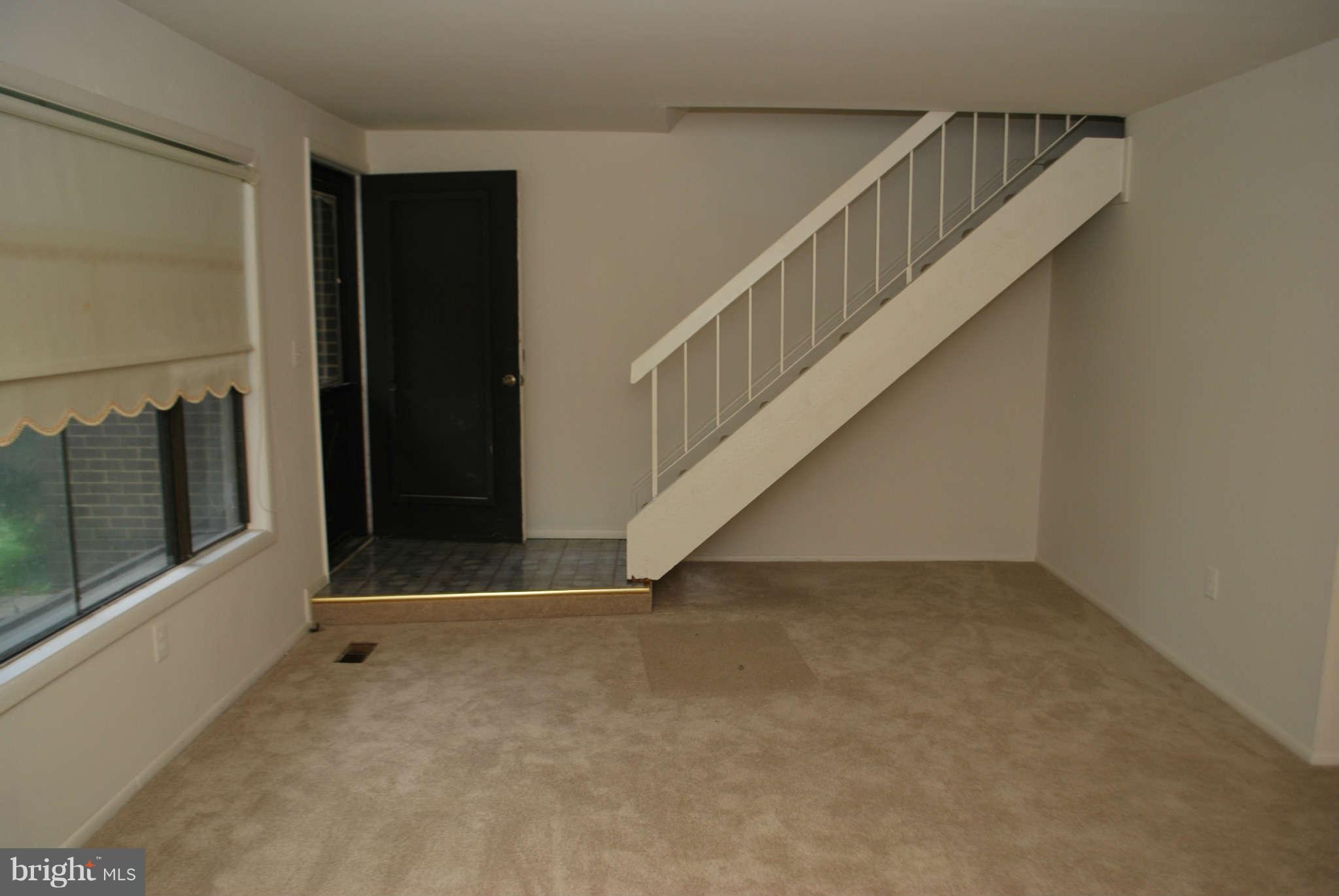 9116 Centerway Road Gaithersburg, MD 20879 - Photo 4 of 25 a view of an entryway with staircase