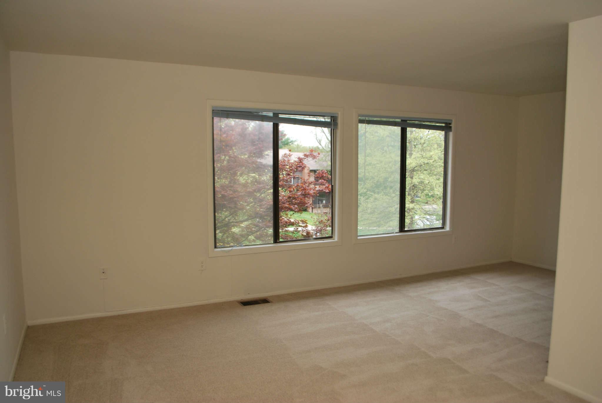 9116 Centerway Road Gaithersburg, MD 20879 - Photo 10 of 25 an empty room with windows