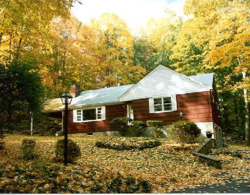 374 Mill Road Stamford, CT 06903 - Photo 1 of 1 front view of house with a yard