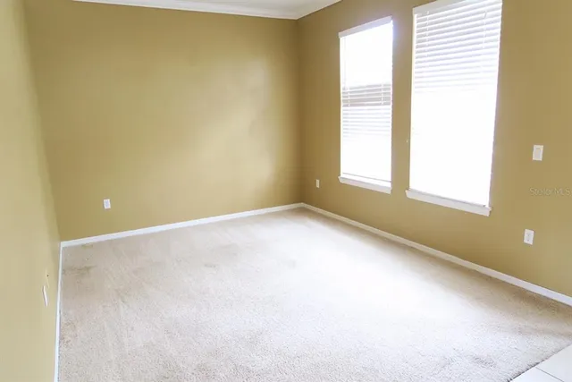 an empty room with a empty space and a window