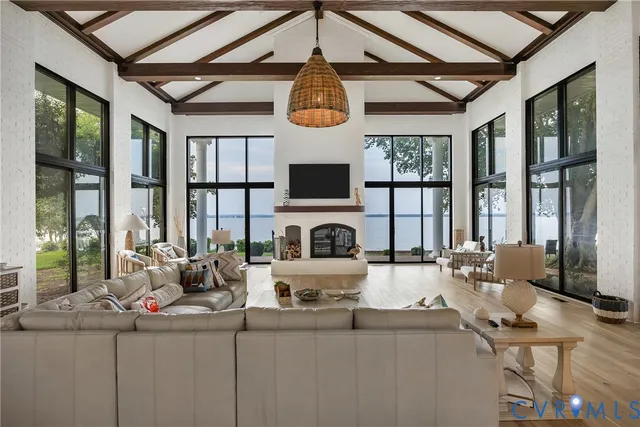 a living room with fireplace furniture and a flat screen tv