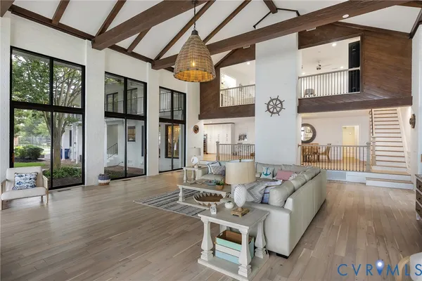 a living room with furniture window and wooden floor